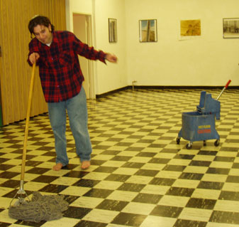 Yoav mopping the floor without any shoes